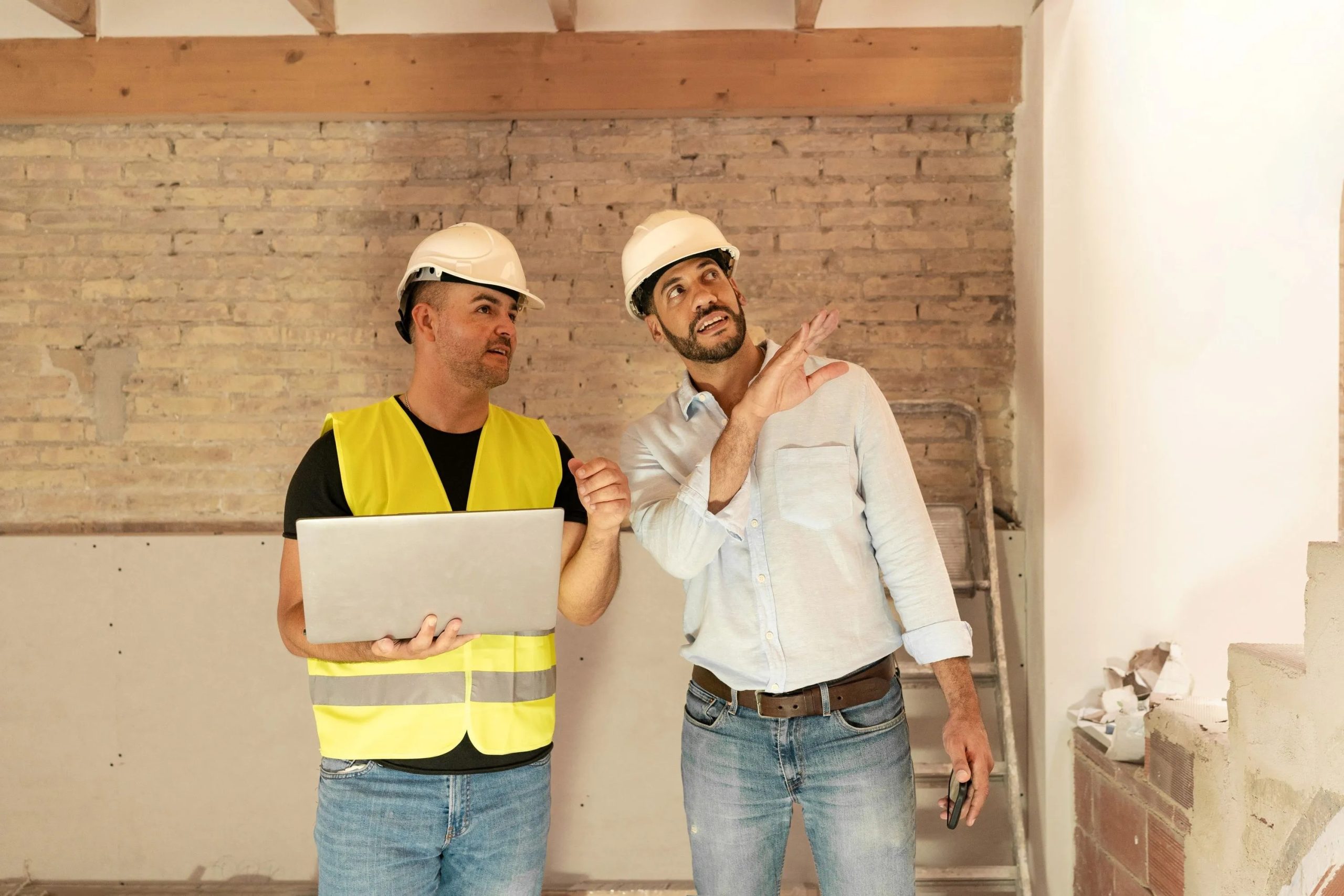 demolition crew carefully removing interior walls during Calgary renovation